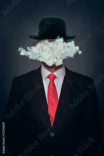 Cloud covering face of man wearing hat against black background