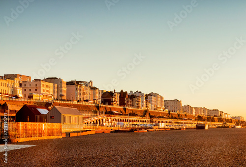  Brighton, East Sussex, UK - Hotels on the seafront at Brighton, from the beach during winter sunrise. Clear blue sky. photo