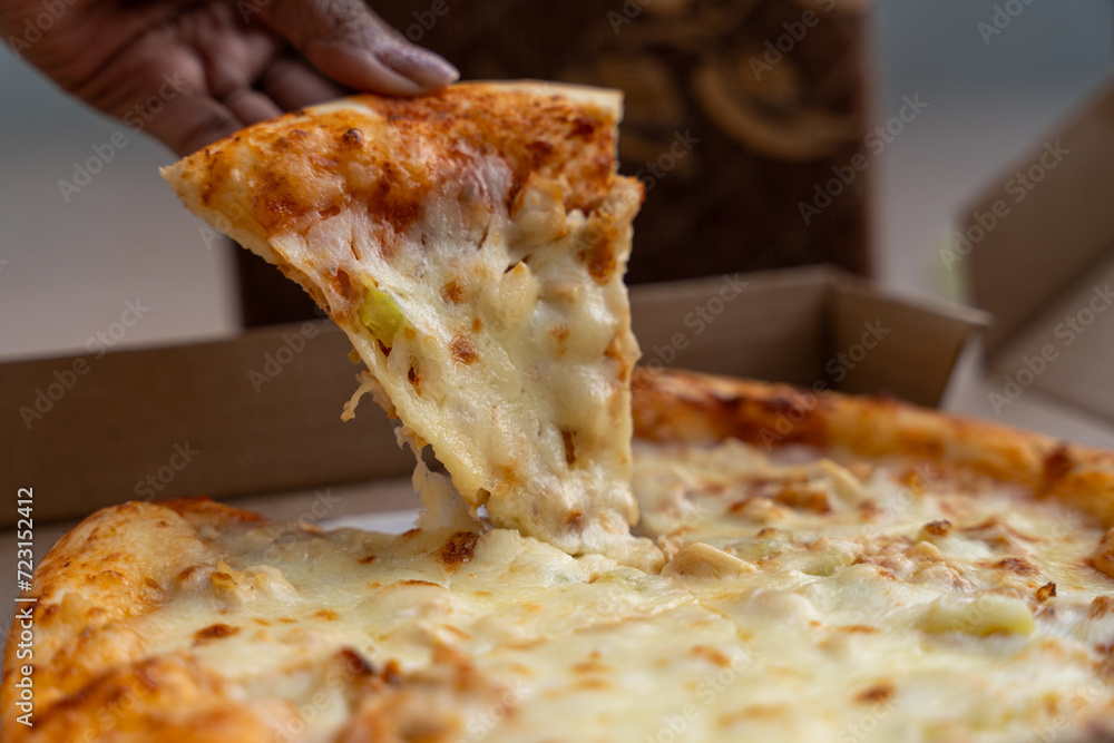 pizza slice taking short, fast food, obesity, danger for health, huge quantity of cheese