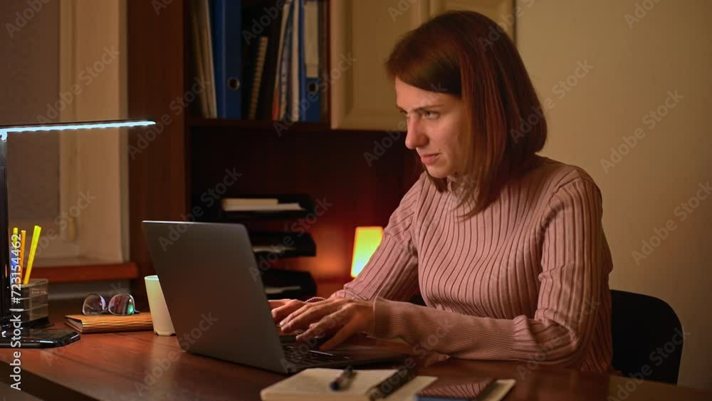 A businesswoman is typing on her laptop at her office desk, but she is not happy with her work. She is disappointed, angry, and confused, as she faces various challenges and problems. A businesswoman is typing on her laptop at her office desk, but she is not happy with her work. She is disappointed, angry, and confused, as she faces various challenges and problems.