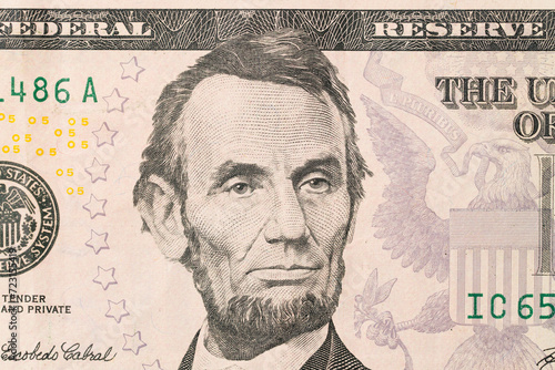 US President Abraham Abe Lincoln on USA five dollar bill macro, 5 usd photo