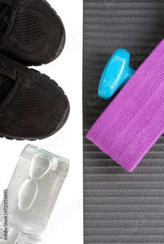 Top view yoga mat dumbbeell, shoe, bottle of water and fitness elastic band. Concept sport and healty life.