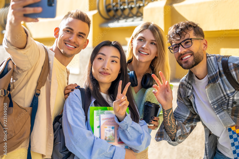 Obraz premium Students making selfie after classes in college.
