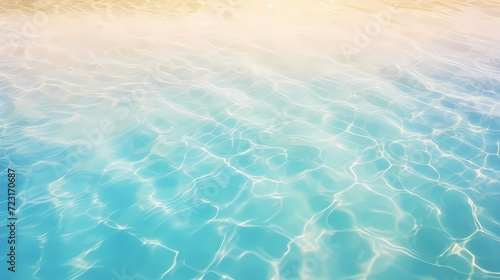 Sandy beach with light blue transparent water waves and sunlight, tranquil aerial beach scene