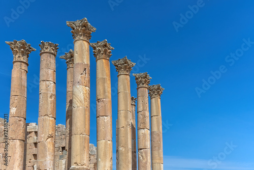 Columns of the Temple of Zeus against a blue sky. Ruins of Jerash , Free space for your text is ready. Jordan.