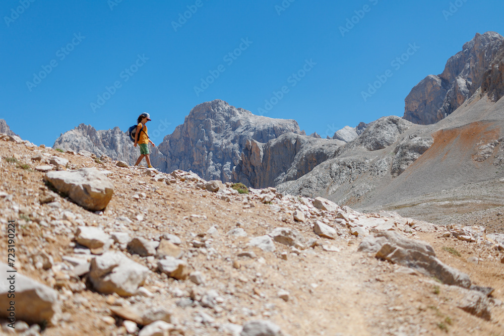child travels in the mountains with a backpack. mountain hike in high mountains. Turkey. child travels in the mountains with a backpack. mountain hike in high mountains. Turkey.