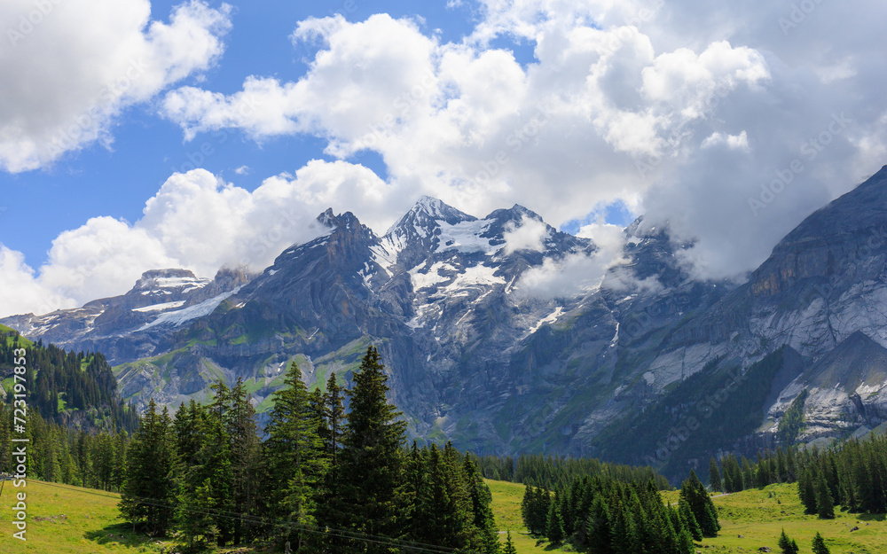 View of Kandersteg Alps with snowy peaks covered with clouds