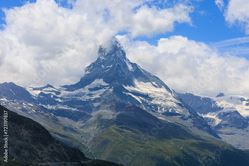 Alpine view of Matterhorn peak covered with clouds. © Indra