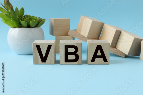Wallpaper Mural blue background. wooden cubes with text. VBA Torontodigital.ca
