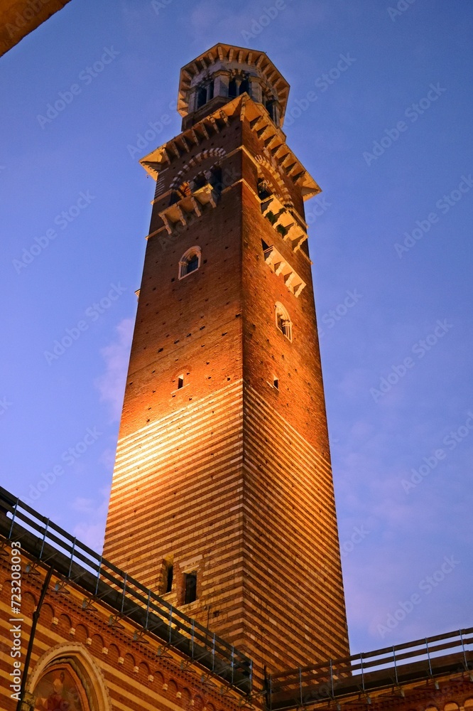 night view of the Torre dei Lamberti from the courtyard of the Mercato Vecchio in the historic center of Verona in Italy