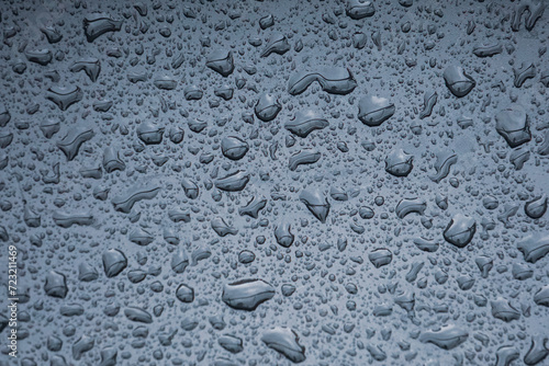  raindrops on the metallic surface in rainy days