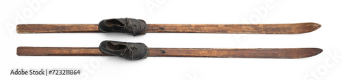 old wooden skis with boots isolated on white background photo