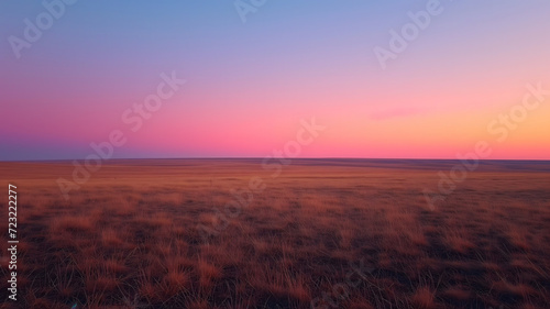 Twilight hues over vast tranquil grassland