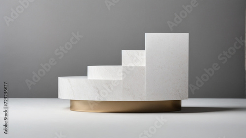 White stone podium with gilding on white table with gray wall background. High quality photo
 photo