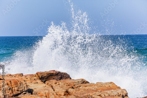 Rocky Beach Ocean Waves Crashing White Water Spray Closeup Landscape.