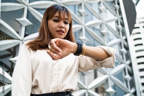 Checking the time during busy day in Chiang Mai photo