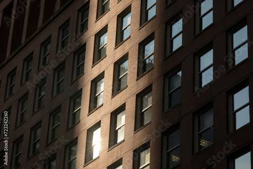 Straight windows grid on a brown brick building