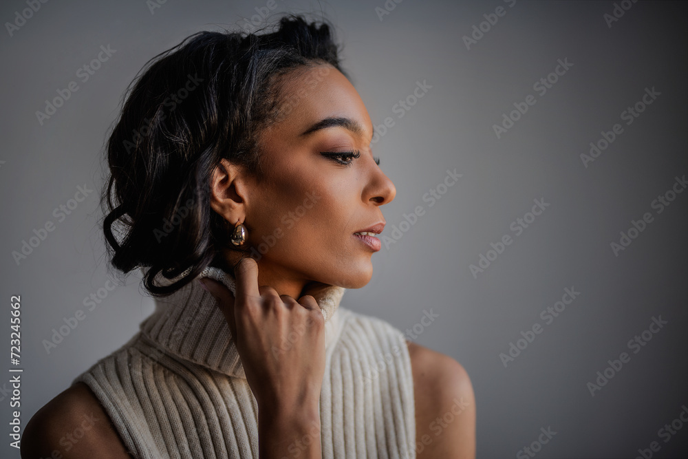 Attractive african american woman against grey background