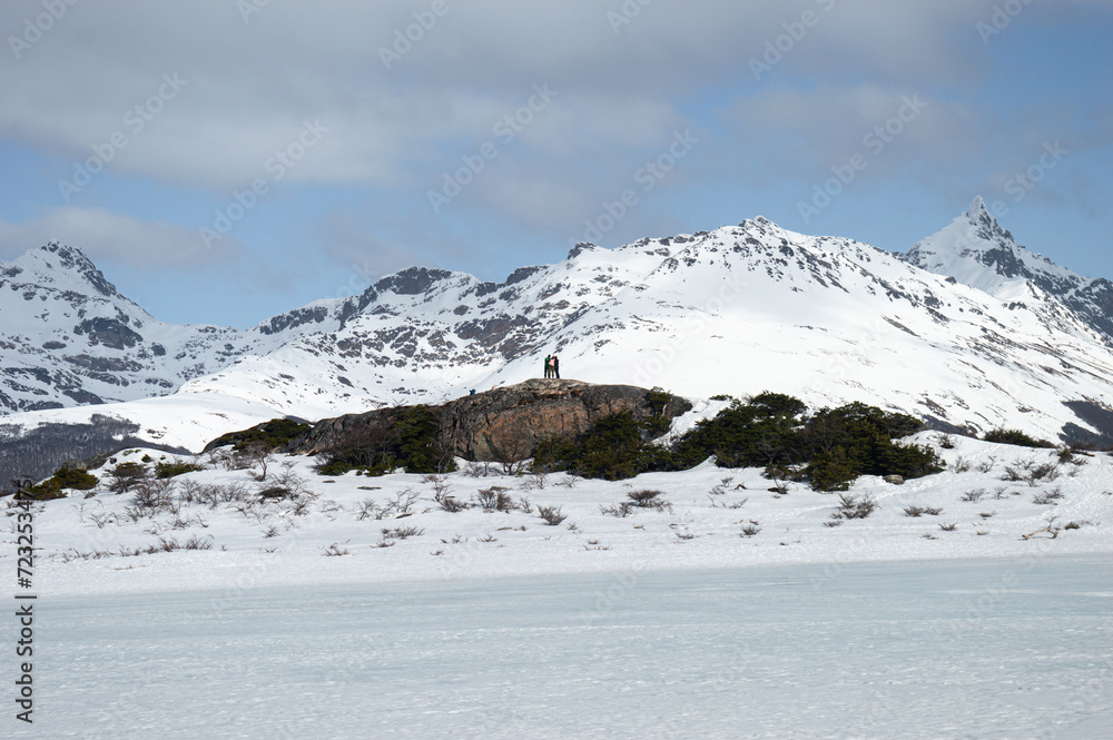 People doing winter trekking, snowy Andes mountains. Ushuahia, Patagonia