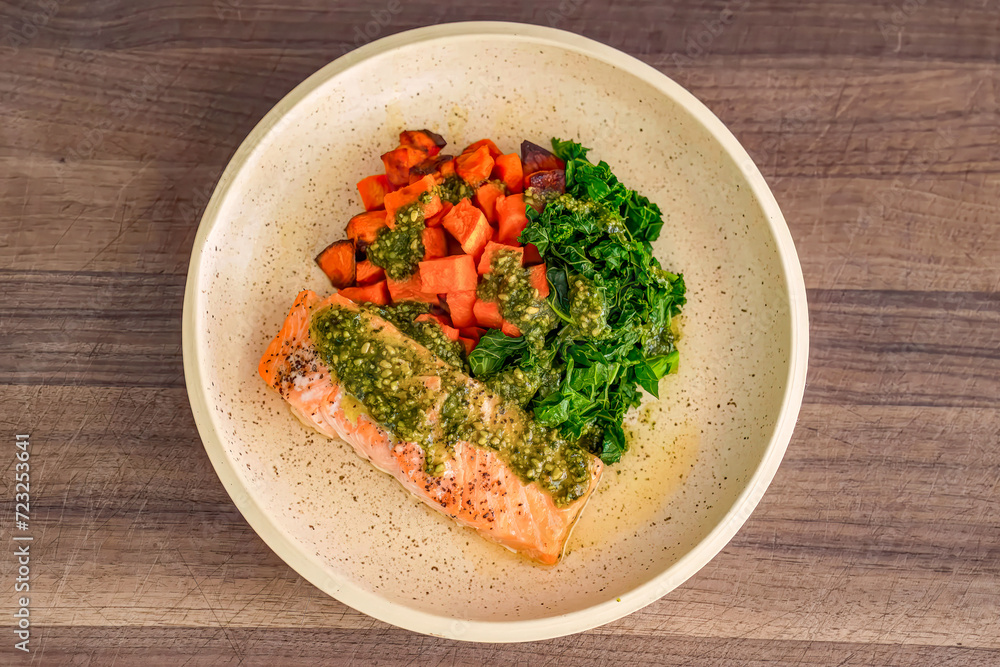 Healthy fresh meal with vegetables, salmon on plate. Homemade delicious lunch with salmon, greens for restaurant, menu, advert or package, close up selective focus. Top view. Healthy fresh meal with vegetables, salmon on plate. Homemade delicious lunch with salmon, greens for restaurant, menu, advert or package, close up selective focus. Top view.