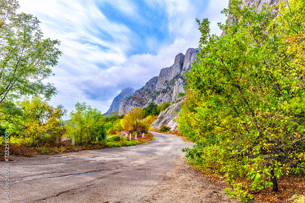 Road running along steep cliffs Road running along steep cliffs