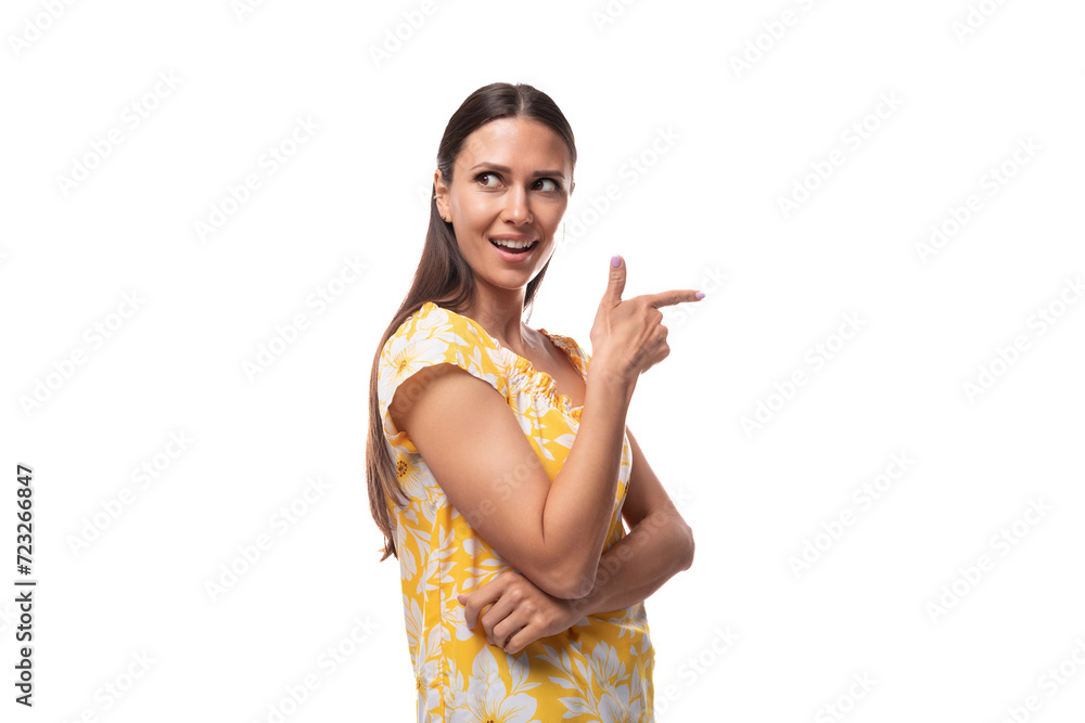 young pretty brunette woman dressed in a summer yellow t-shirt on a white background young pretty brunette woman dressed in a summer yellow t-shirt on a white background