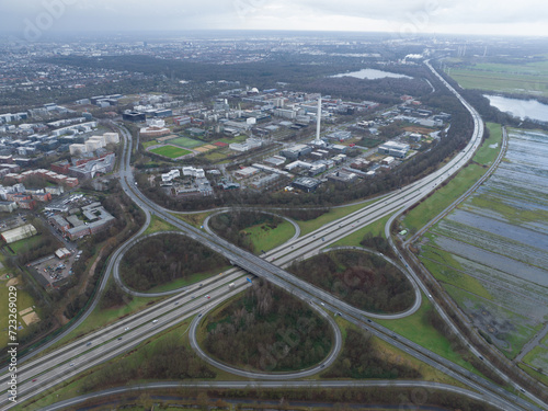 German autobahn infrastructure and interstate crossing. Birds eye aerial drone view. Hannover, Germany.