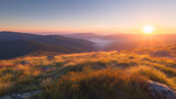 A serene mountain landscape at sunrise bathed in soft golden light.