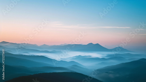 A serene mountain landscape during sunrise. © Leandro