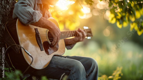 A serene outdoor scene with a folk musician playing an acoustic guitar under a tree.