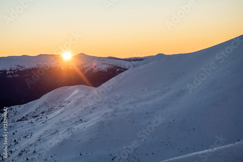 magical sunrise on a mountain peak. snowy Mountain peaks. fairytale calming landscape