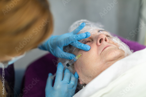 An elderly person experiences rejuvenation treatments at a beauty salon.