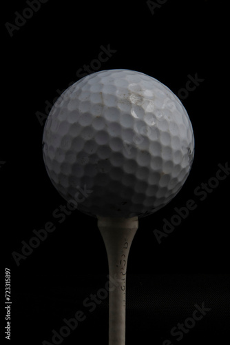 golf ball on tee isolated