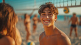 A young guy smiling looks at the camera. He plays beach volleyball with friends