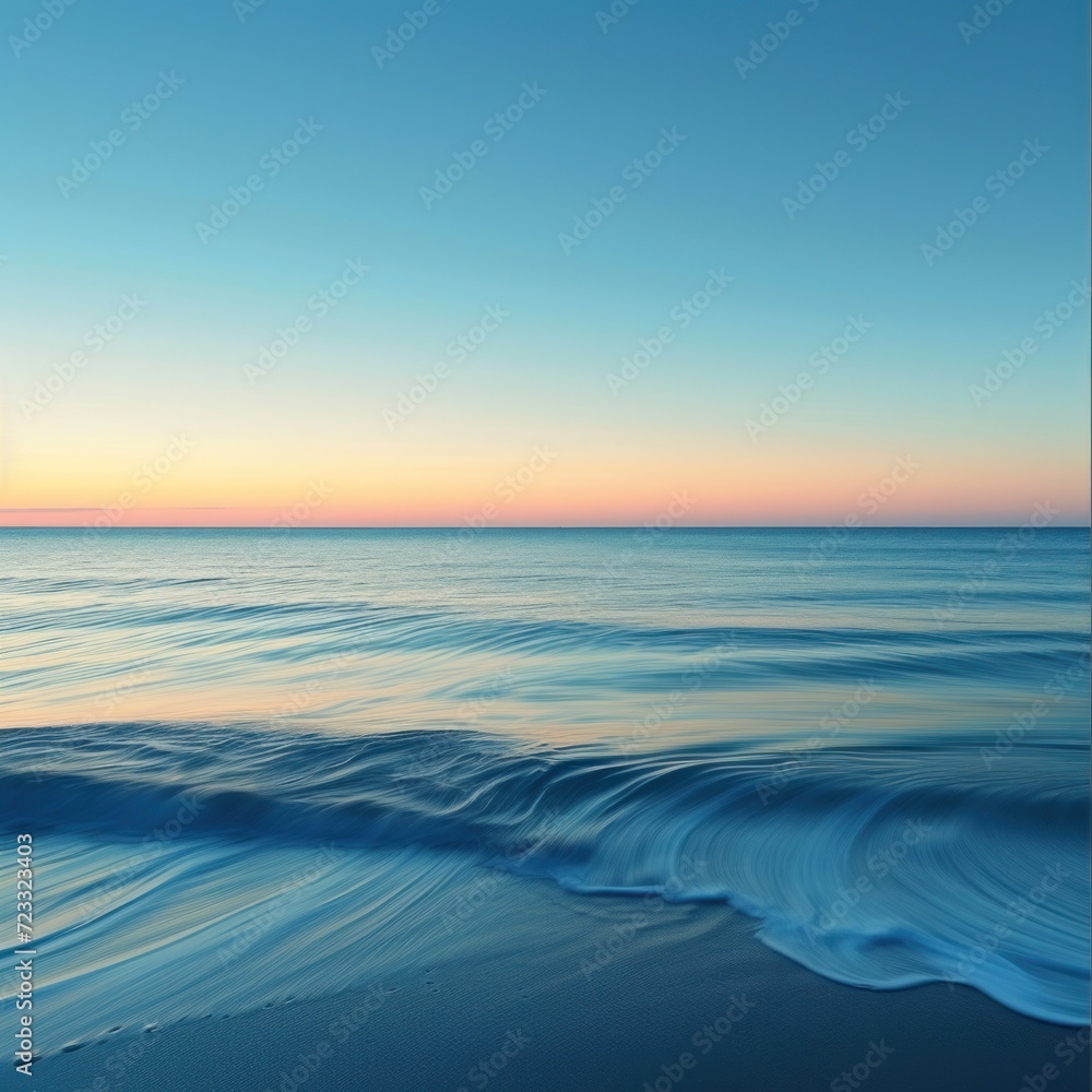  a view of the ocean at sunset with a wave in the foreground and an orange and blue sky in the background with the sun reflecting off of the water.