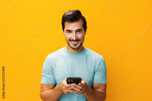 Man smiling happy communication mobile portrait smartphone technology copy phone cyberspace space studio phone yellow