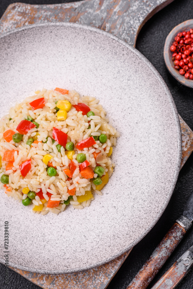 Delicious white boiled rice with vegetables, sweet peppers, carrots, peas Delicious white boiled rice with vegetables, sweet peppers, carrots, peas