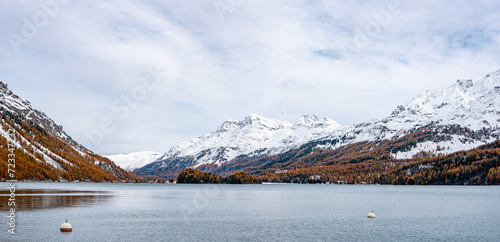Lake Silsersee in autumn with snowcapped mountains, near St. Moritz in Switzerland photo