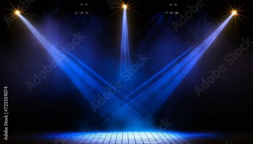 illuminated stage with blue lights and smoke on black background © Slainie