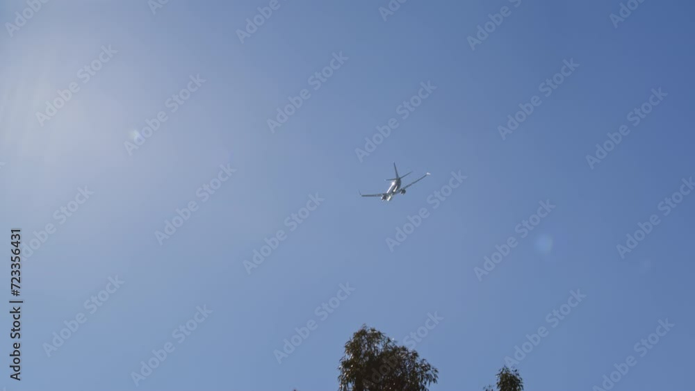 Airplane fly away though the blue sky. Large passenger airplane is taking off against the skies. Airliner landing on landing strip at airport Airplane fly away though the blue sky. Large passenger airplane is taking off against the skies. Airliner landing on landing strip at airport