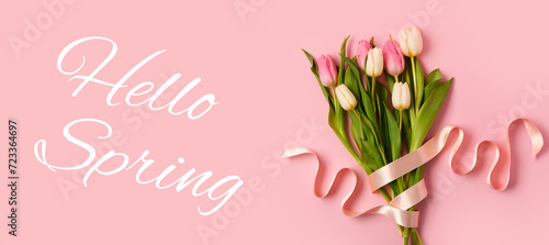 Bouquet of beautiful tulips and text HELLO, SPRING on pink background