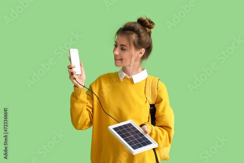 Pretty young woman charging...
