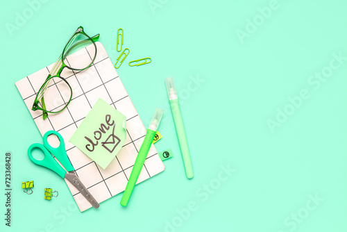 Sticky note with word DONE,...
