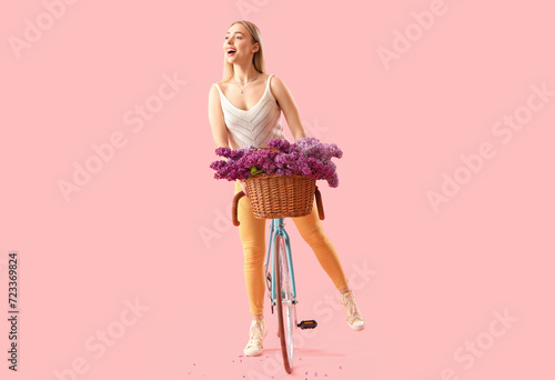 Young woman with lilac flow...