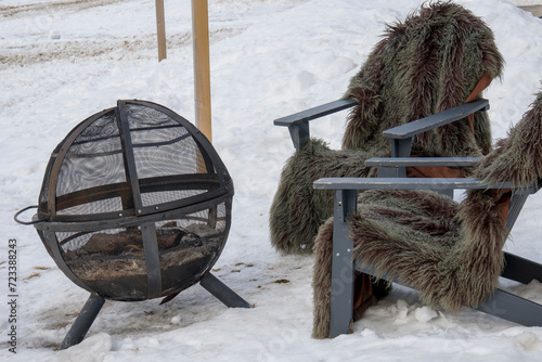 The Incles Valley Andorra Blankets, fireplace and furniture outside a resort in the snow-covered mountains photo