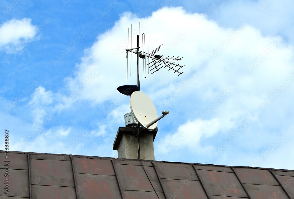 Satellite dish , antennas dvb-t2 on the roof of the house Satellite dish , antennas dvb-t2 on the roof of the house