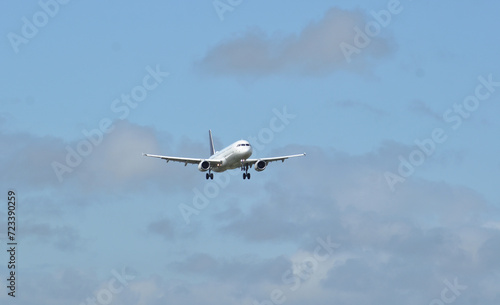 Passenger jet plane approaching the runway for landing