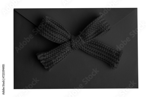 Black envelope with a bow on a blank background.