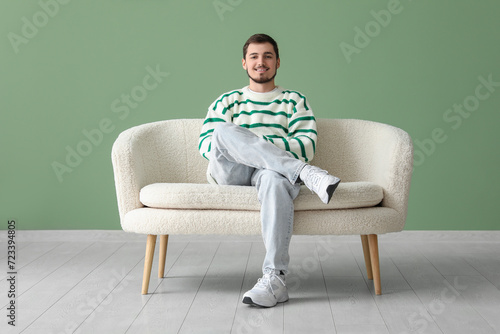 Handsome young man sitting ...