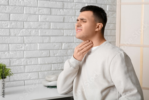 Young man with thyroid glan...